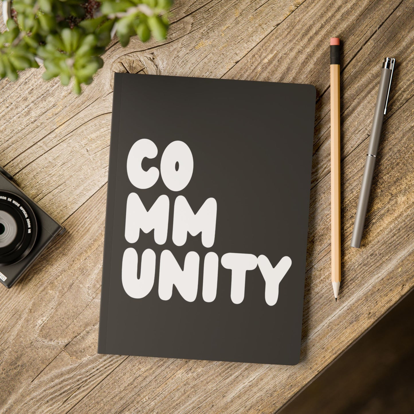 Community in Black and White Soft Cover Journal on a table - The APWT Gift Shop