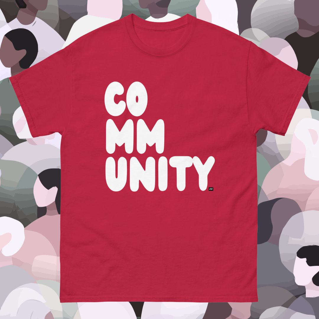 Red t-shirt with 'COMMUNITY' printed on it against a colorful abstract background
