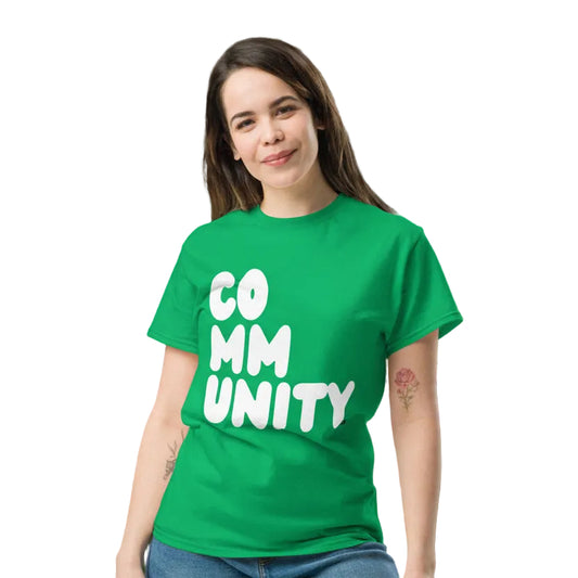 Woman wearing the APWT Gift Shop's A Community in Green Grass Unisex T-Shirt from the Community Collection