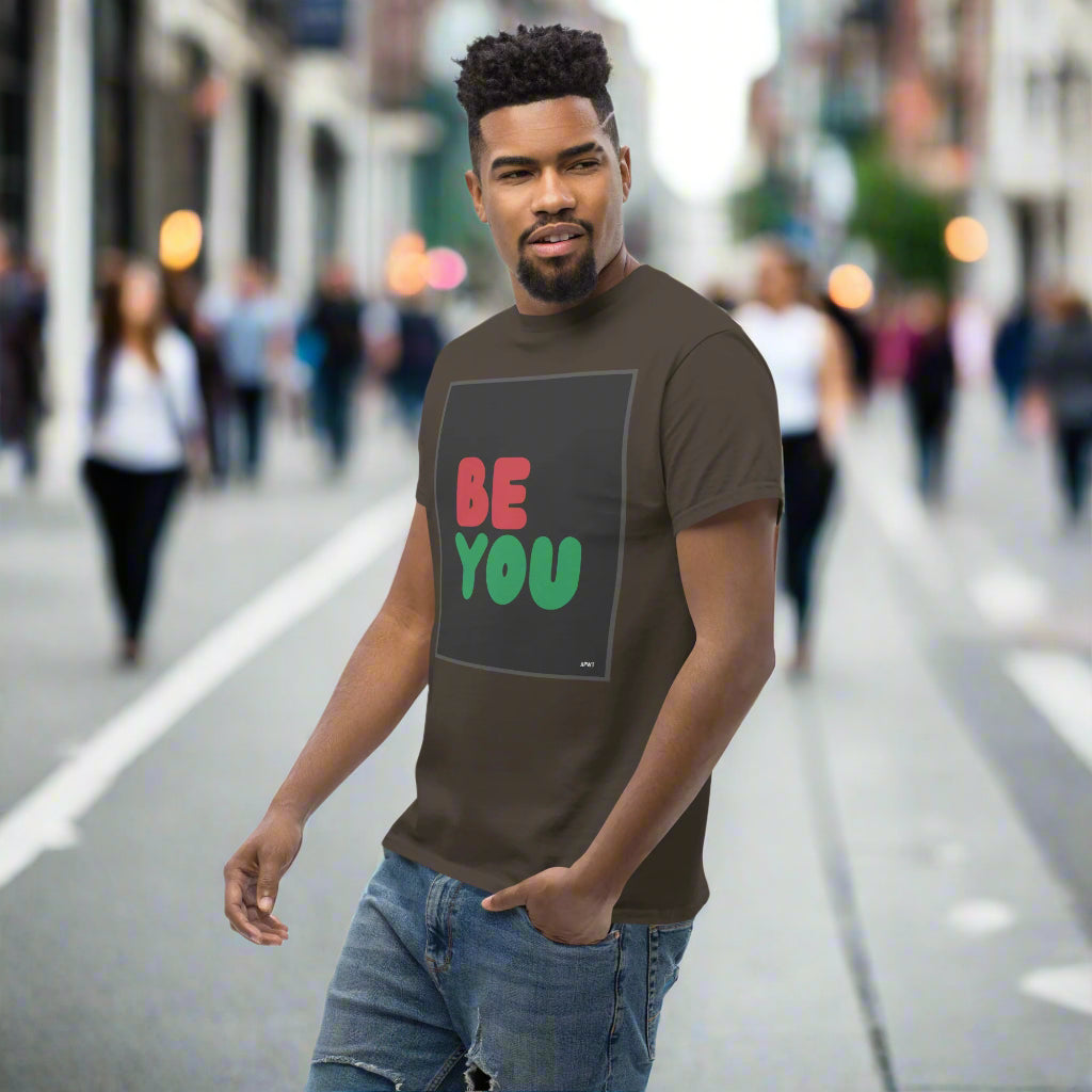 Man wearing the Be You in Black Unisex T-Shirt in Brown on city street - The APWT Gift Shop