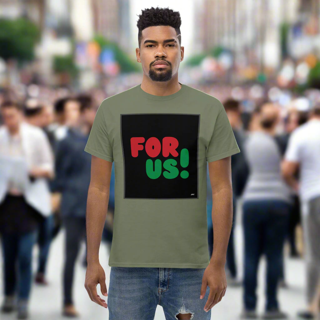 Man wearing the For Us in Black Unisex T-Shirt in Military/Army Green standing on a city street - The APWT Gift Shop