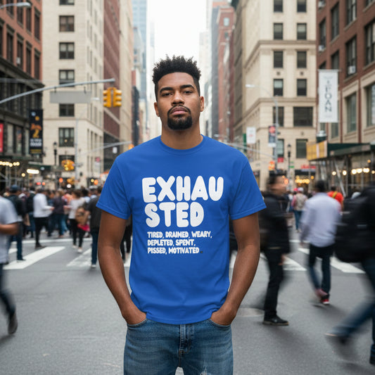 Man standing on a busy city street wearing the APWT Gift Shop's Exhausted in Blue Unisex T-Shirt from the Exhausted Collection