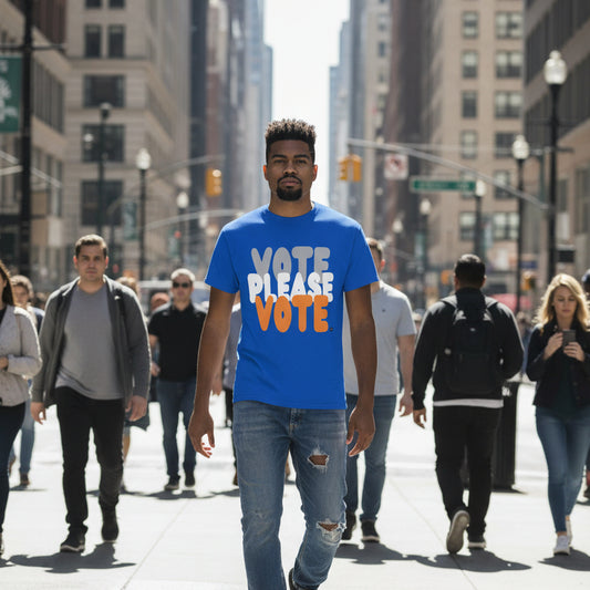 Man walking down the street wearing the APWT Gift Shop's Please Vote in Blue and Orange Unisex T-Shirt from the Community Collection