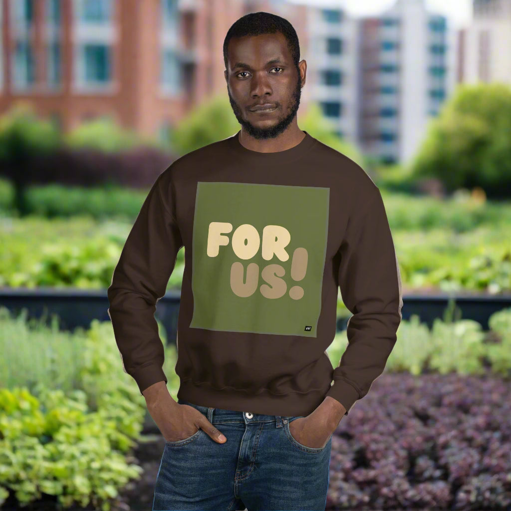 Man wearing the For Us in Green Unisex Crew Neck Sweatshirt in Brown standing in an urban garden - The APWT Gift Shop