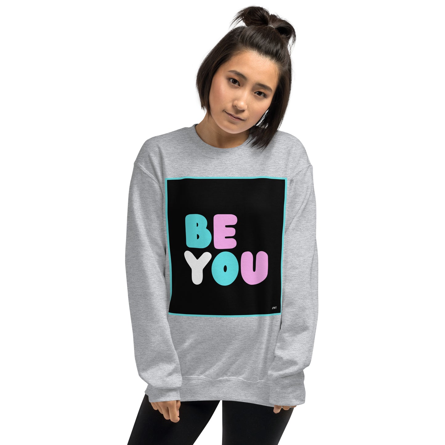 Woman wearing the Be You T Unisex Crew Neck Sweatshirt in Sport Grey - The APWT Gift Shop