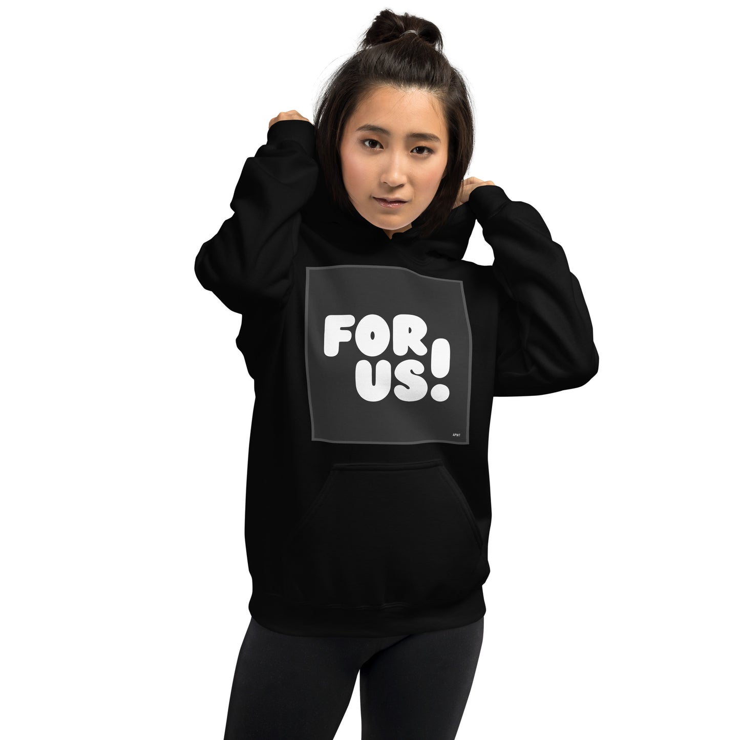 Woman wearing the For Us in Black and White Unisex Hoodie in Black - The APWT Gift Shop