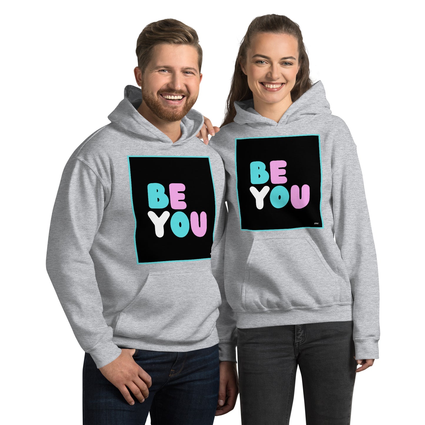 Man and Woman wearing the Be You T Unisex Hoodie in Sport Grey - The APWT Gift Shop