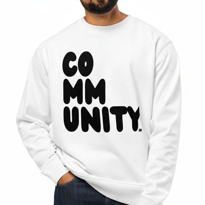 Man wearing a white sweatshirt with 'COMMUNITY' printed on it against a white background