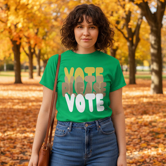 Woman standing in the park on an Autumn day wearing the APWT Gift Shop's Please Vote in Green Spaces Unisex T-Shirt from the APWT Vote Shop