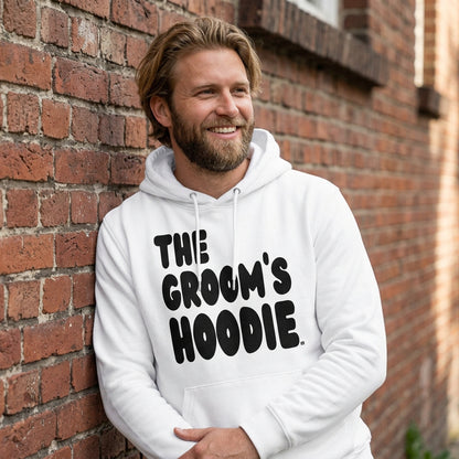 Man wearing the Groom's Hoodie Premium Unisex White Hoodie From the APWT Wedding Shop