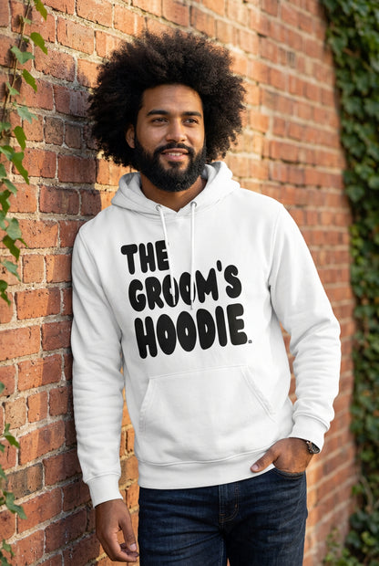 Man wearing the Groom's Hoodie Premium Unisex White Hoodie From the APWT Wedding Shop