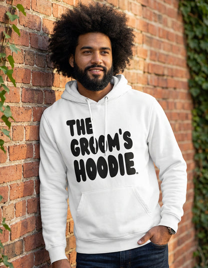 Man wearing the Groom's Hoodie Premium Unisex White Hoodie From the APWT Wedding Shop