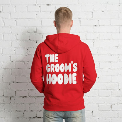 Man wearing the Groom's Hoodie Premium Unisex Zip-Up Hoodie From the APWT Wedding Shop in Red - Back View