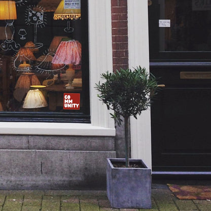 A Community in Apple Red Vinyl Sticker