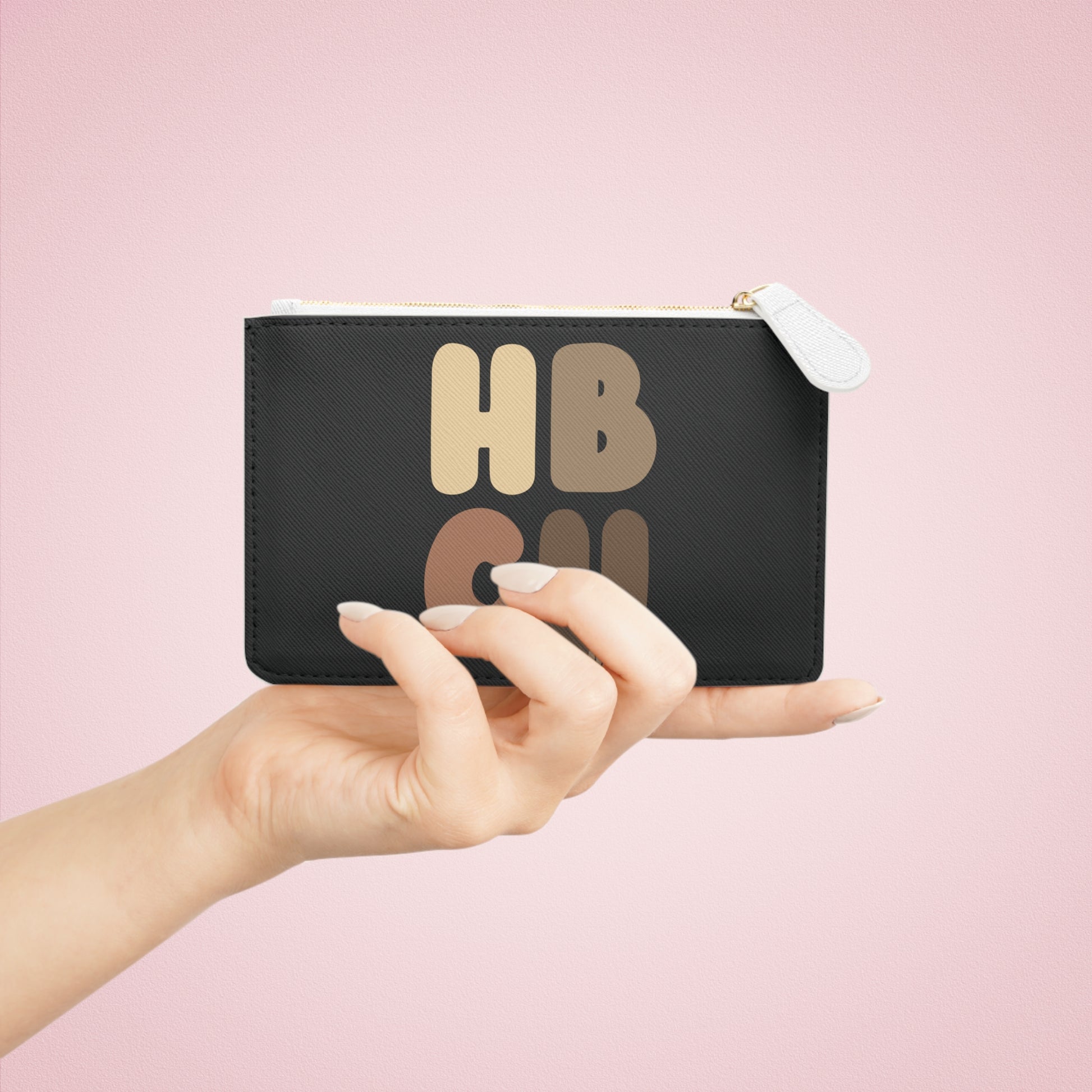 A hand holding the HBCU Graduate Small Zip-Up Pouch - The APWT Gift Shop