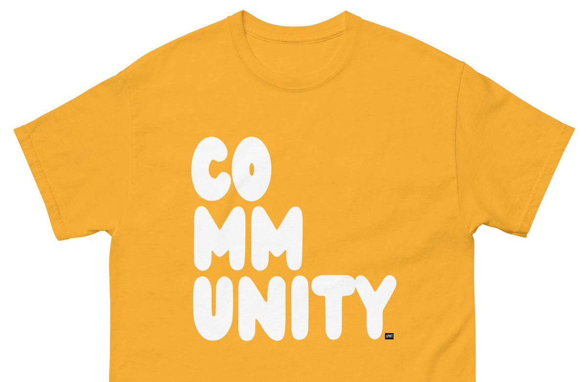 The APWT Gift Shop's A Community in Sunflower Yellow Unisex T-Shirt from the Community Collection - Front Close-Up