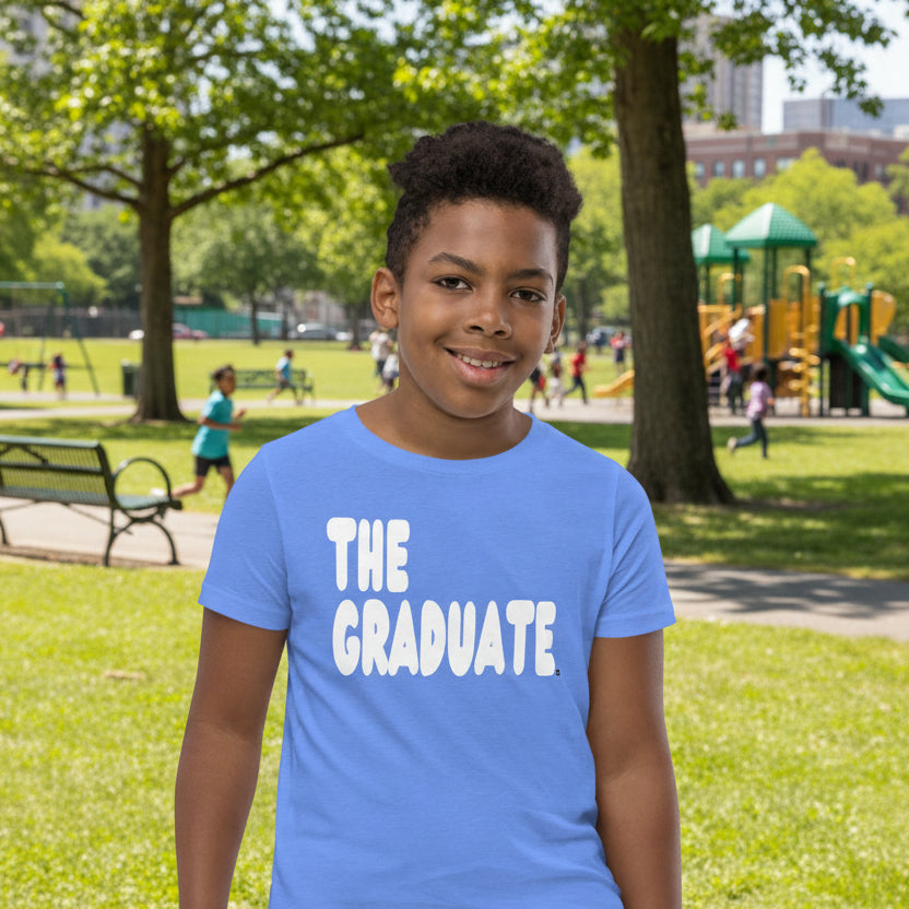 Boy wearing The Graduate Kid's Unisex T-Shirt in Light Blue from the APWT Gift Shop