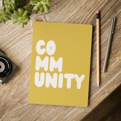 A Community in Yellow Soft Cover Journal on a table - The APWT Gift Shop