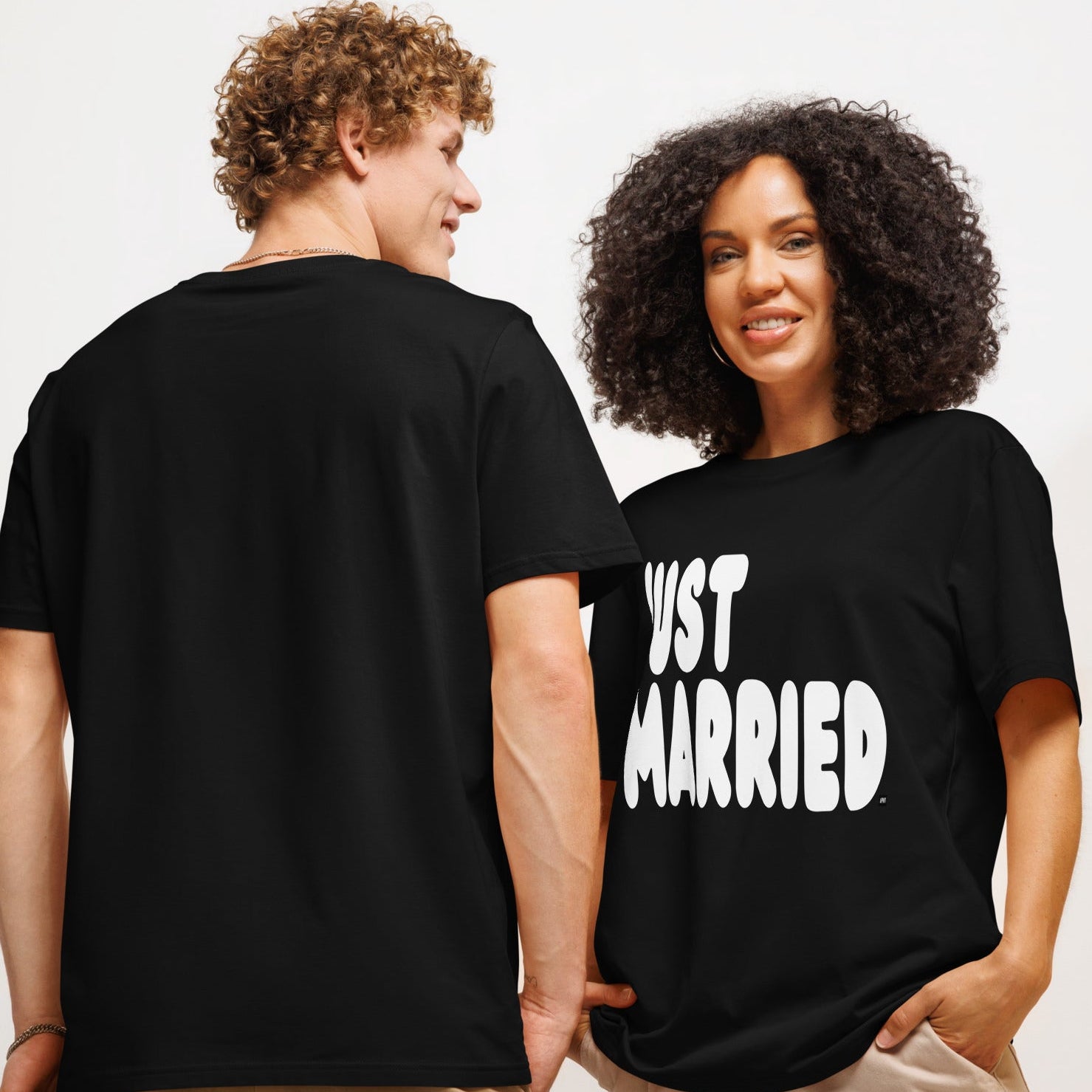 Couple wearing Just Married Premium Unisex T-Shirt in Black
