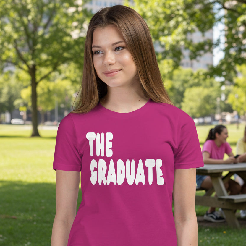 Girl wearing The Graduate Kid's Unisex T-Shirt in Berry from the APWT Gift Shop