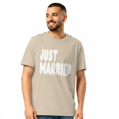 Man wearing the APWT Gift Shop's Just Married Premium Unisex T-Shirt in Beige from the APWT Wedding Shop