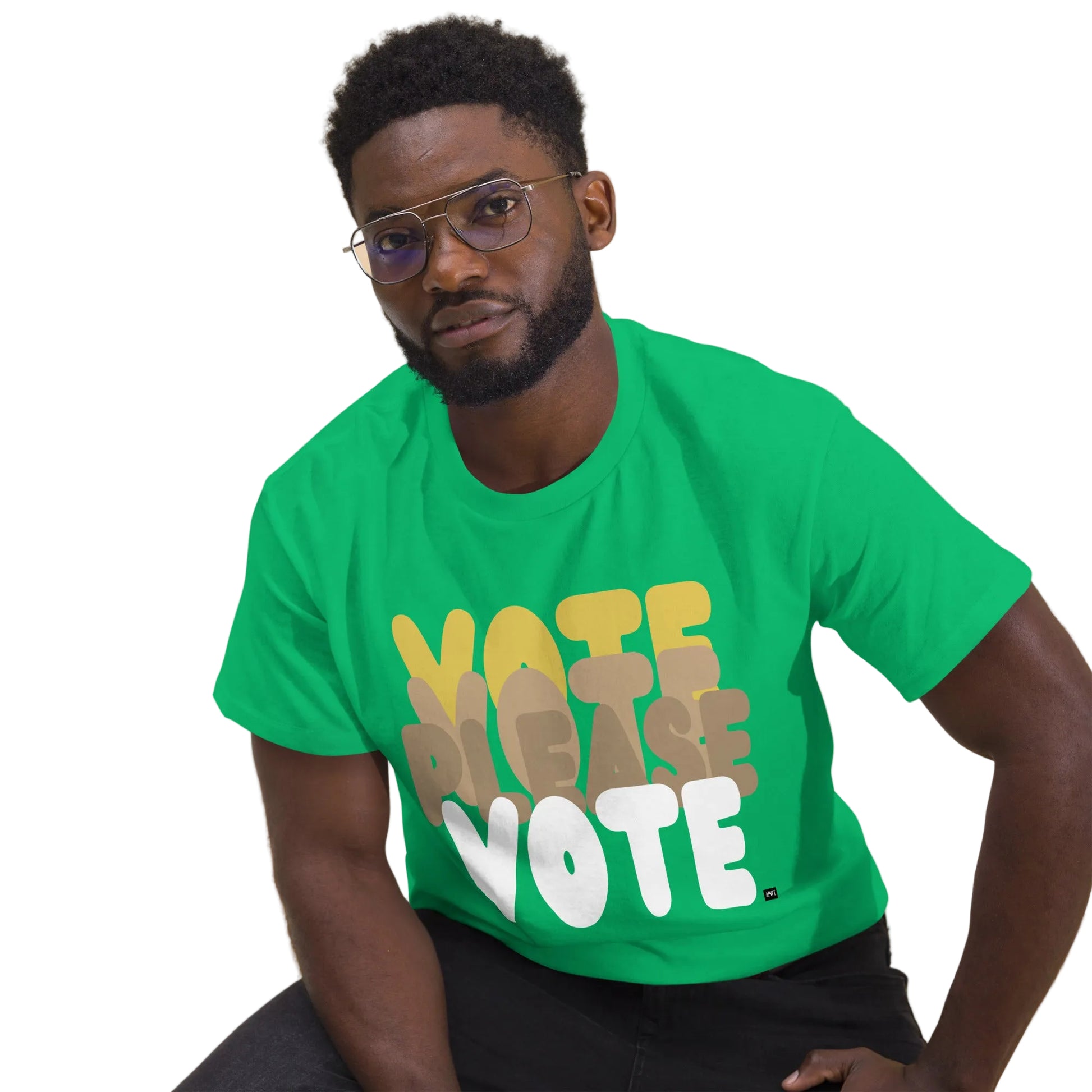 Man wearing Please Vote in Green Spaces Unisex T-Shirt from the APWT Gift Shop Sitting