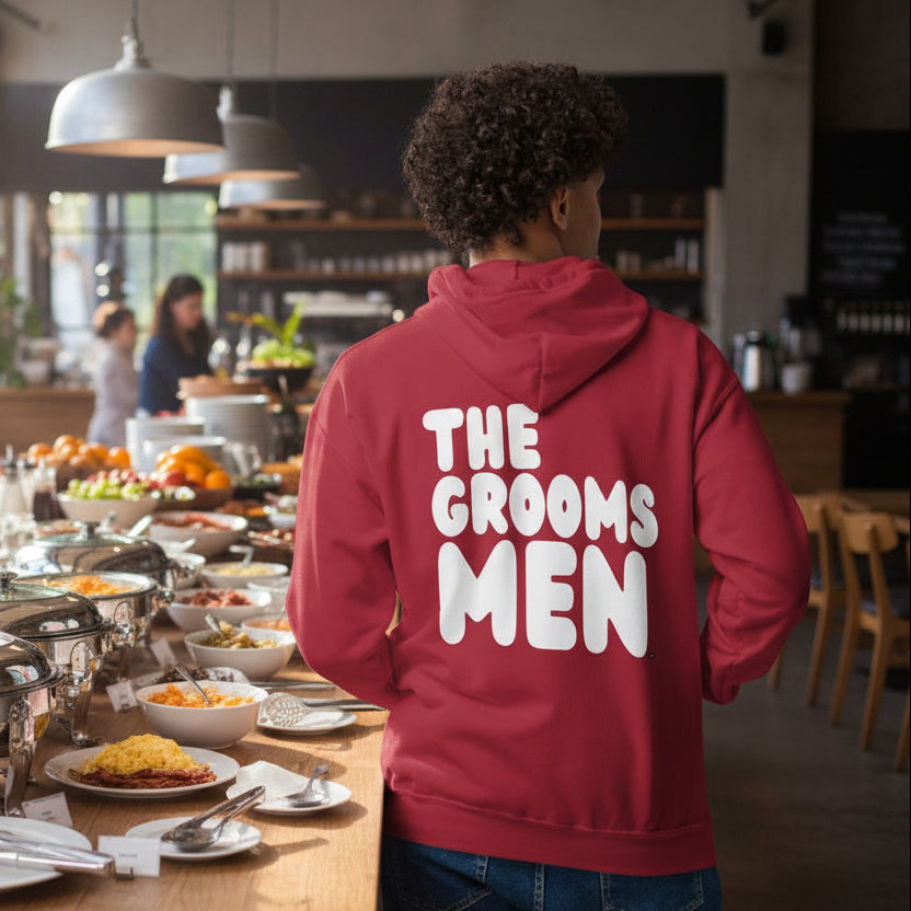 Man wearing The Groomsmen Unisex Zip-Up Hoodie in Apple Red
