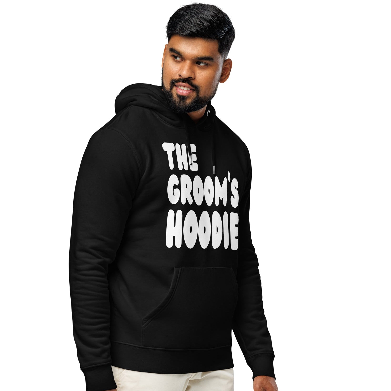 Man wearing the The Groom's Hoodie Premium Unisex Hoodie in Black from the APWT Gift Shop Side