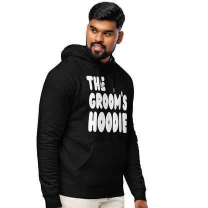 Man wearing the The Groom's Hoodie Premium Unisex Hoodie in Black from the APWT Gift Shop Side