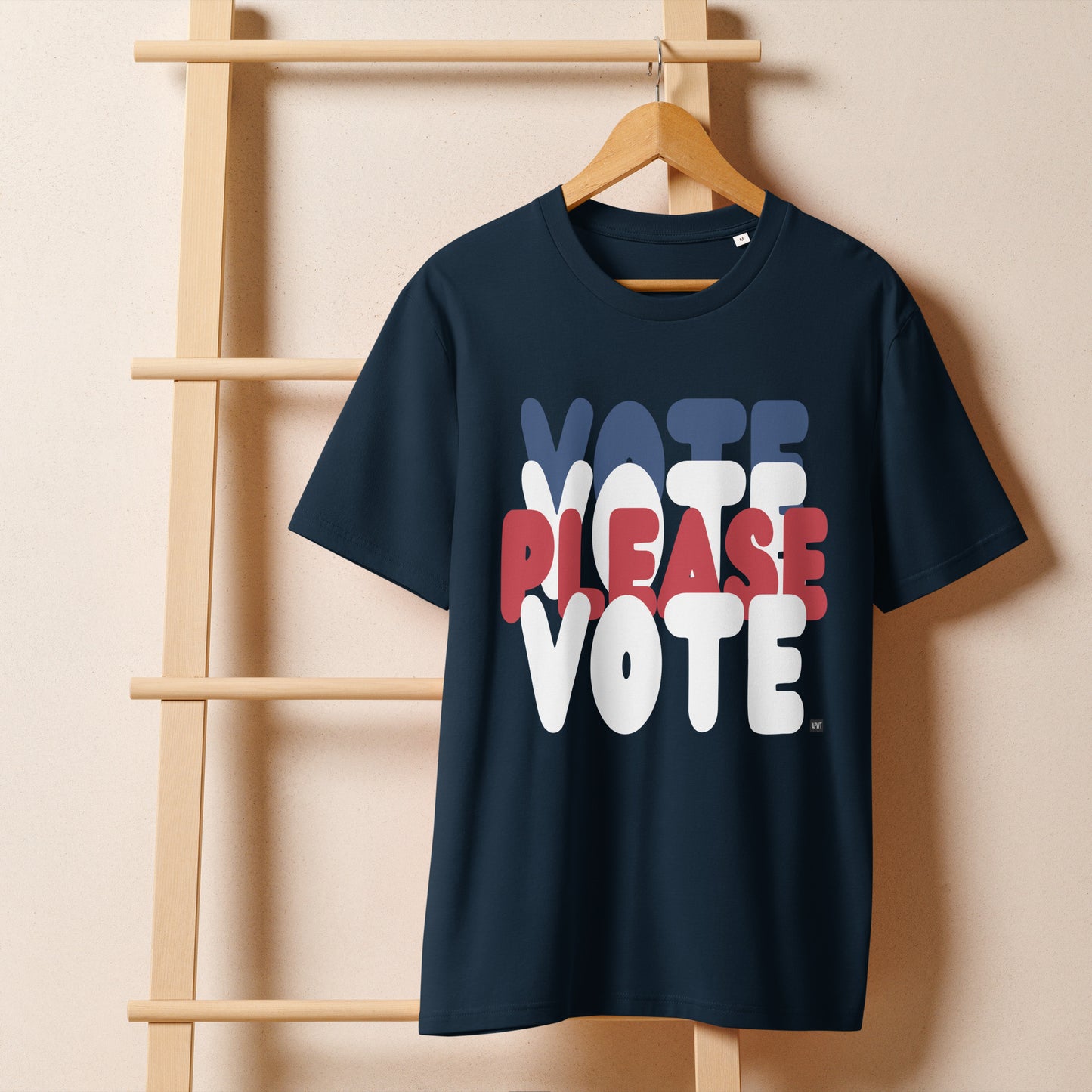 Please Vote Unisex T-Shirt in Navy Blue on a hanger