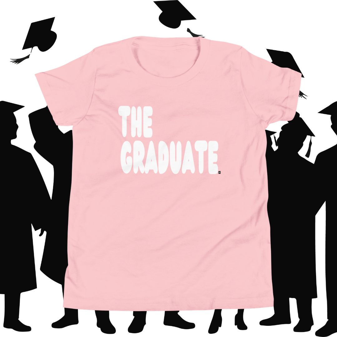 Pink t-shirt with 'THE GRADUATE' text against a white background with black silhouette of graduates.