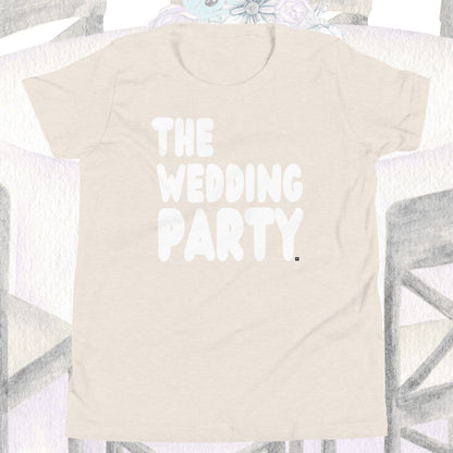 Beige t-shirt with 'THE WEDDING PARTY' text on a decorative background