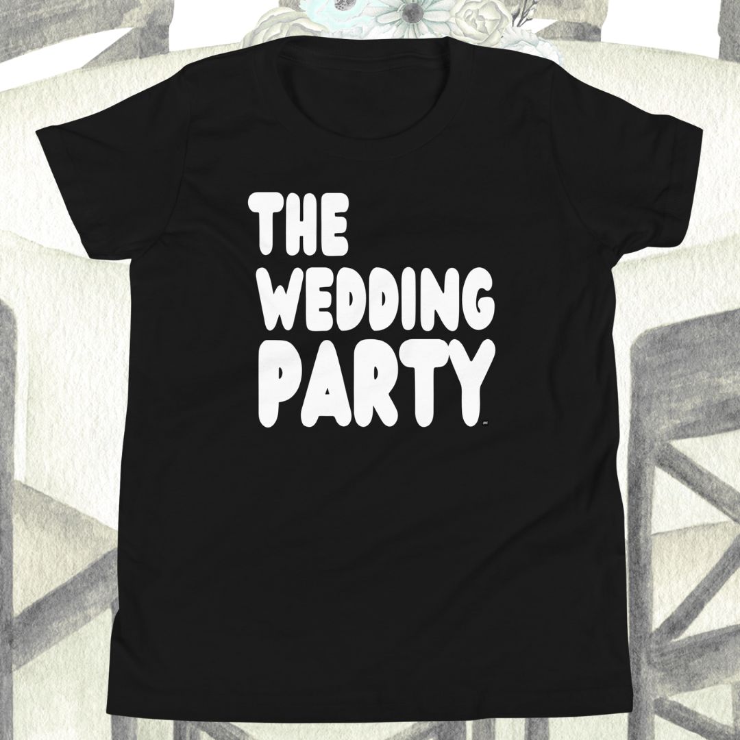 Black t-shirt with 'THE WEDDING PARTY' text on a textured surface