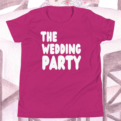 Pink t-shirt with 'THE WEDDING PARTY' text on a decorative background