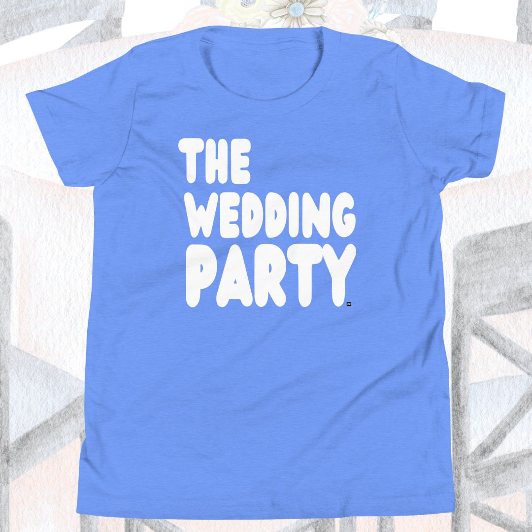 Blue t-shirt with 'THE WEDDING PARTY' text on a white surface