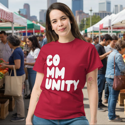 Woman wearing A Community in Apple Red Unisex T-Shirt from the APWT Gift Shop