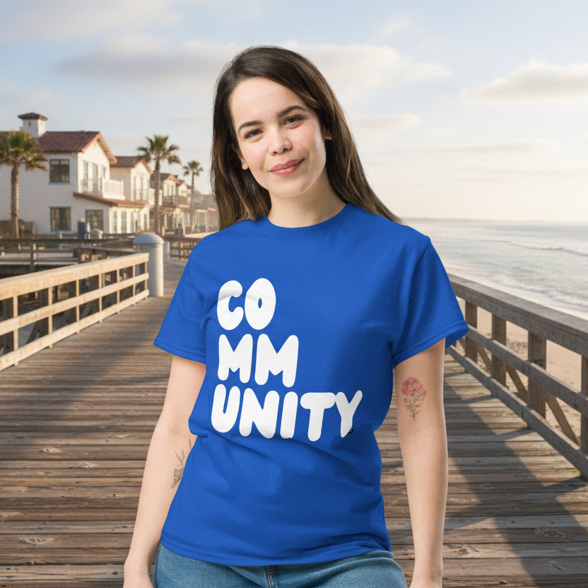 Woman wearing A Community in Ocean Blue Unisex T-Shirt from the APWT Gift Shop