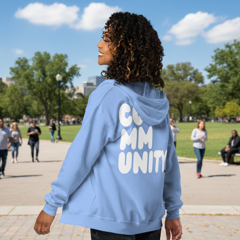 Woman wearing A Community in Sky Blue Unisex Zip-Up Hoodie