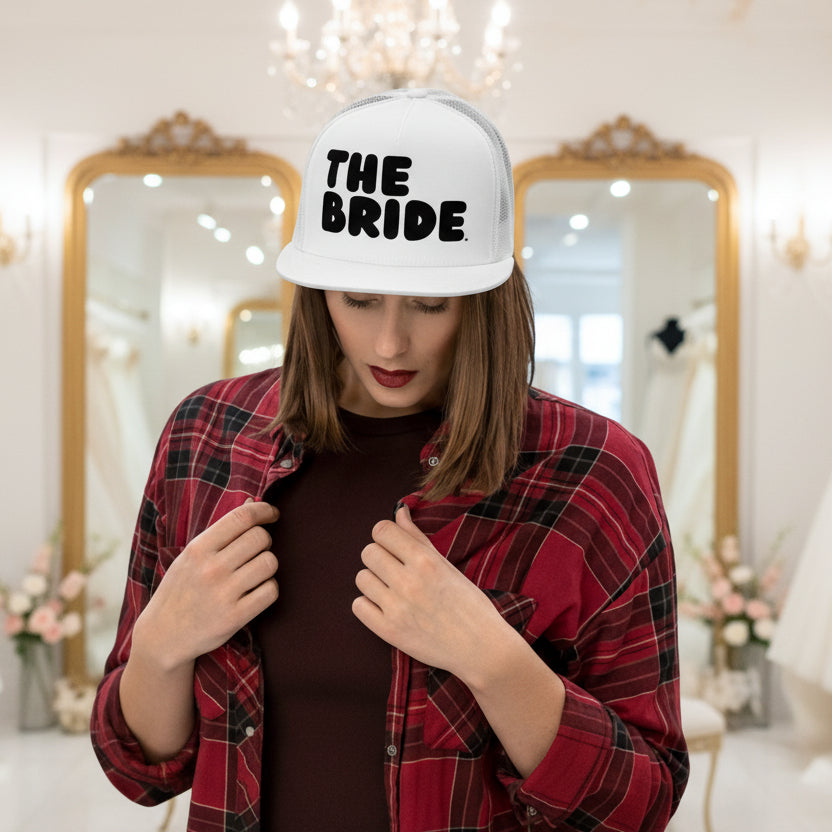 Woman wearing The Bride Trucker Hat from the APWT Gift Shop in white