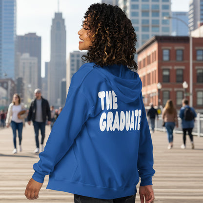Woman wearing The Graduate Unisex Zip-Up Hoodie from the APWT Gift Shop in Royal Blue