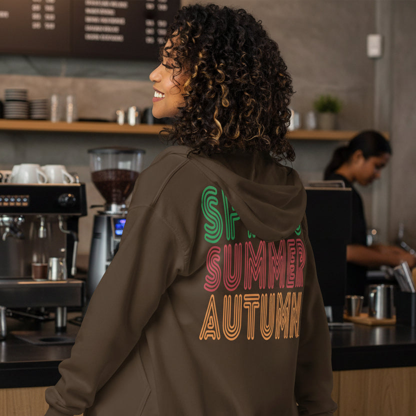 Woman wearing The Spring into Summer Unisex Zip-Up Hoodie in Brown from the APWT Gift Shop