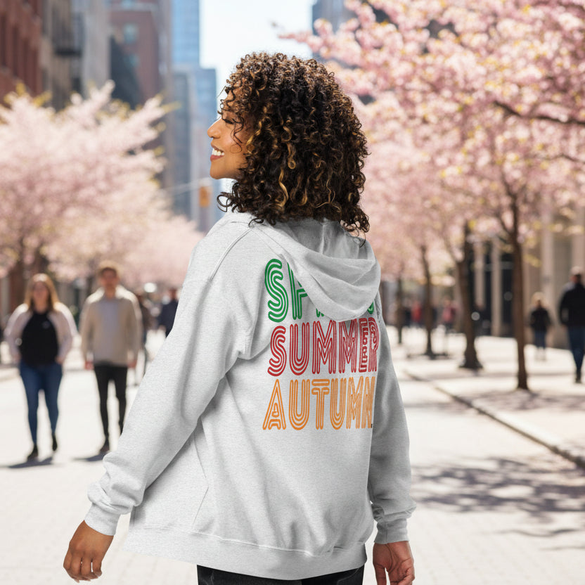 Woman wearing The Spring into Summer Unisex Zip-Up Hoodie in White from the APWT Gift Shop Grey