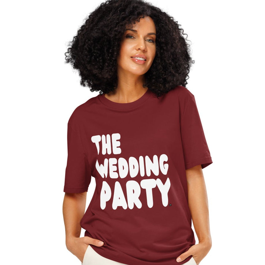 Woman wearing The Wedding Party Premium Unisex T-Shirt in Burgundy from the APWT Gift Shop