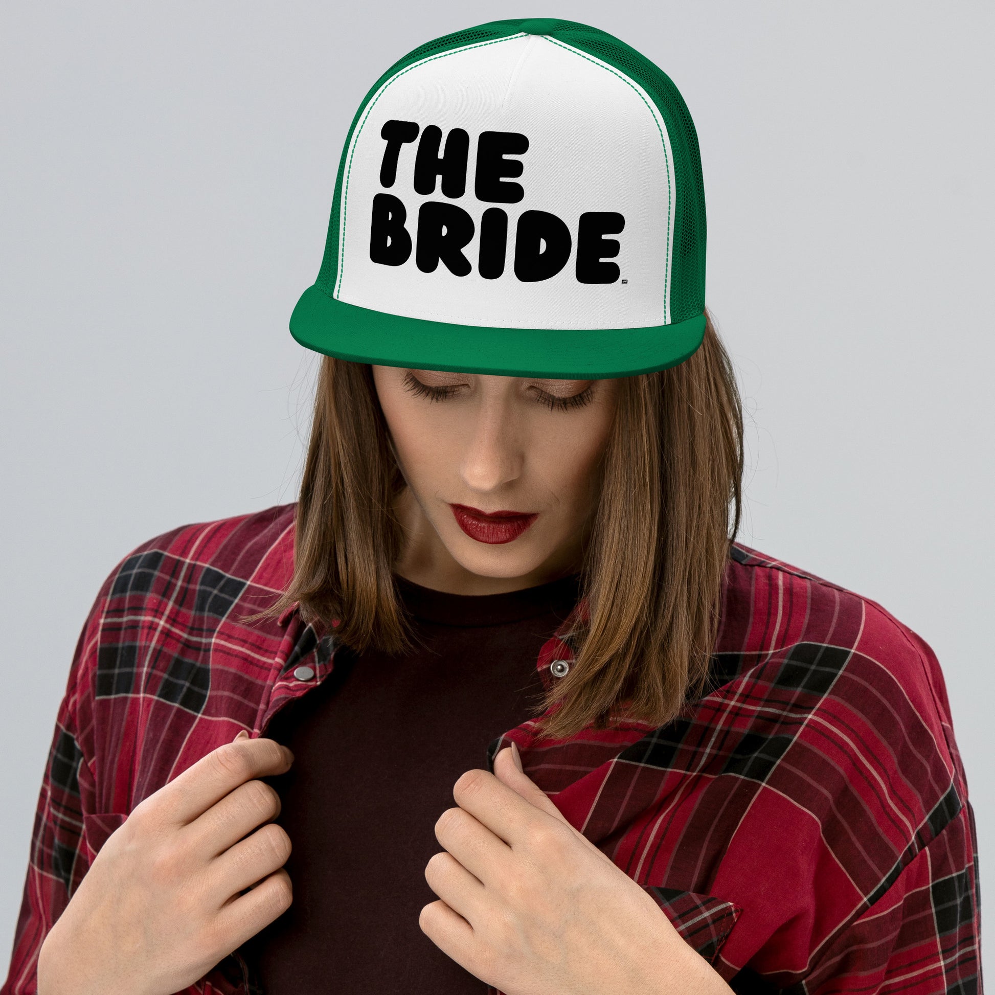 Woman wearing the Bride Trucker Hat from the APWT Gift Shop in Green and White