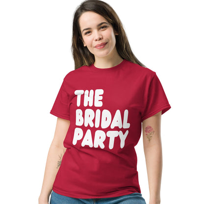 Women wearing The Bridal Party Unisex T-Shirt in from the APWT Gift Shop in Red
