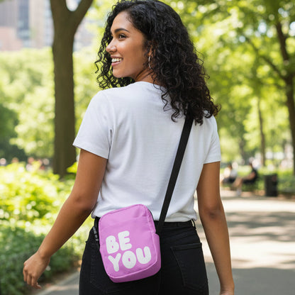 Woman wearing the APWT Gift Shop's Be You in Pink Small Crossbody Bag from the Be You Collection