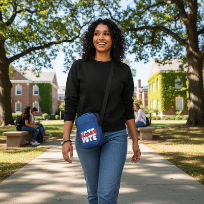 Woman walking on a college campus wearing The APWT Gift Shop's Please Vote Small Crossbody Bag from the APWT Vote Shop