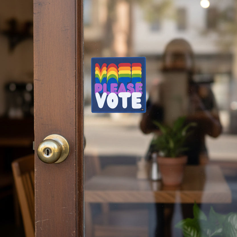 The APWT Gift Shop's Please Vote in Color Vinyl Sticker stuck to the outside of a glass door to a cafe