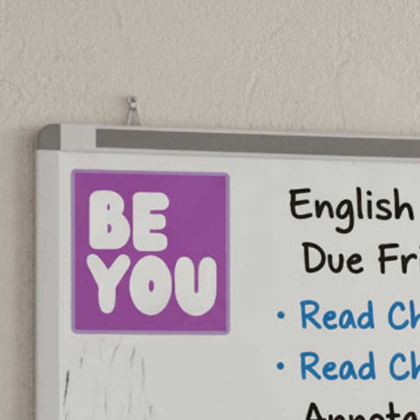The APWT Gift Shop's Be You in Purple Sticker from the Be You Collection stuck to a whiteboard in a classroom