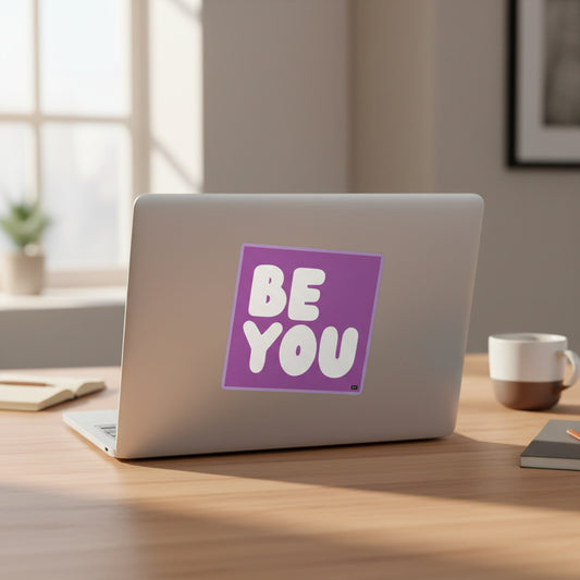 The APWT Gift Shop's Be You in Purple Sticker from the Be You Collection stuck to the back of a laptop